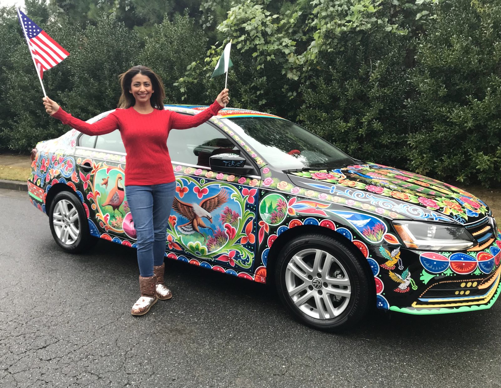 Sanam Azeem with her Pakistani truck art car, hand-painted by artist Haider Ali