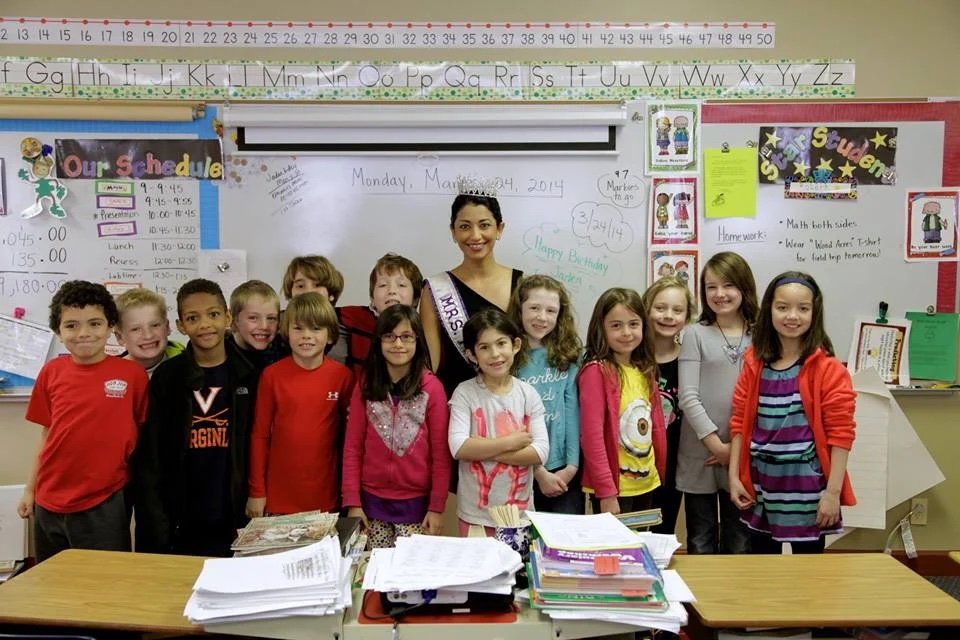 Sanam Azeem as Mrs. Pakistan International with students at Wood Acres School